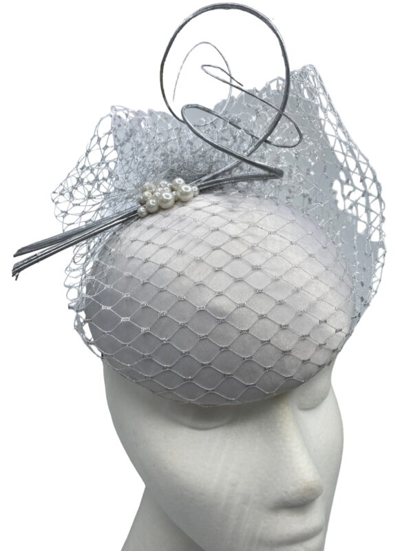 Stunning silver pillbox with silver veiling overlay.